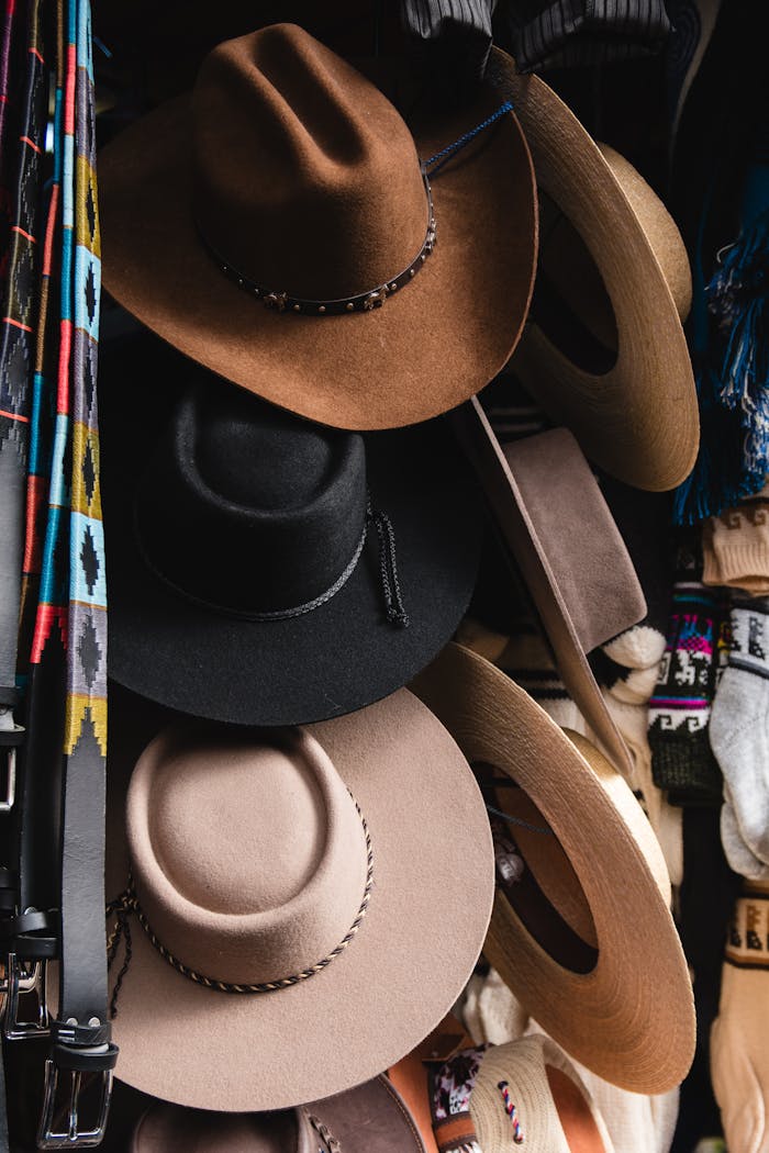 A vibrant array of cowboy hats displayed at a market stall in Chillán, Chile.